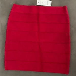 Red Bebe bondage skirt. Brand new. With tags